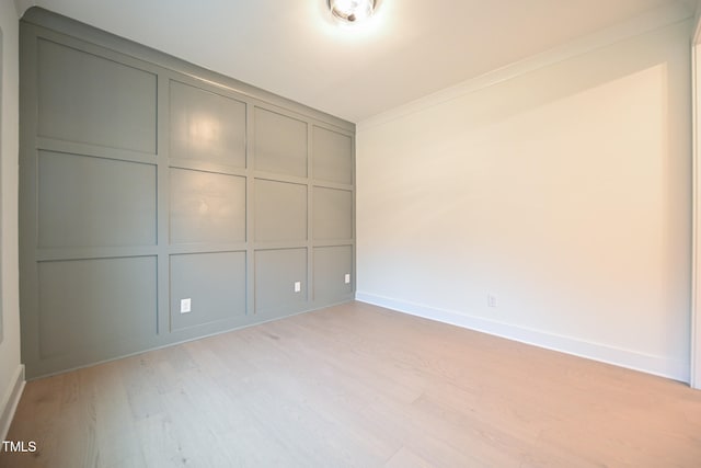 interior space featuring light hardwood / wood-style flooring and crown molding