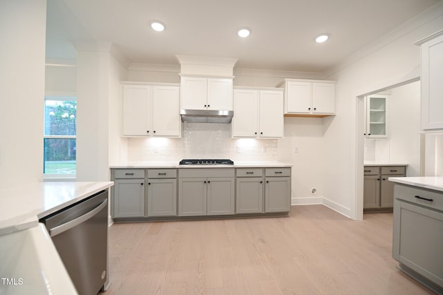 kitchen featuring stainless steel dishwasher, gray cabinets, gas cooktop, and light hardwood / wood-style flooring