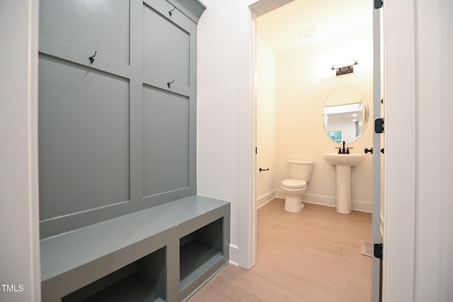 mudroom featuring light wood-type flooring and sink