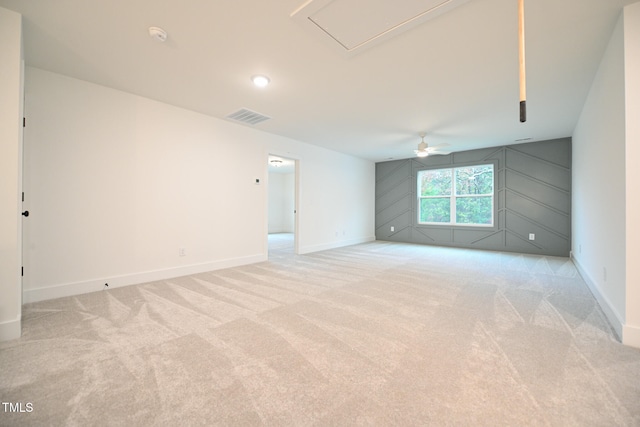 carpeted empty room featuring ceiling fan