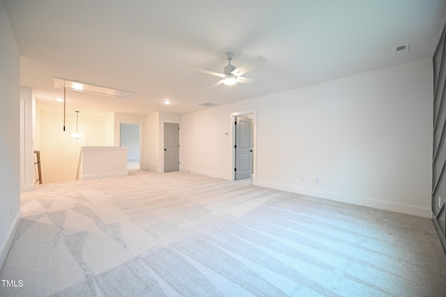 carpeted empty room featuring ceiling fan