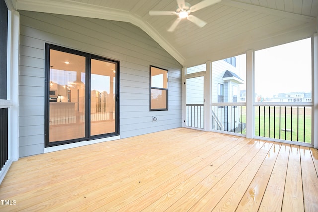 unfurnished sunroom with vaulted ceiling with beams, ceiling fan, and wood ceiling