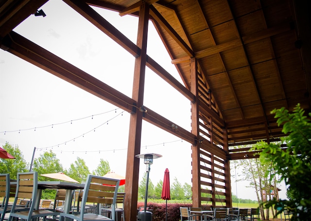 exterior space featuring beamed ceiling and wood ceiling