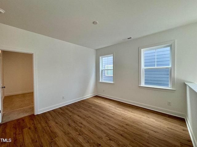 unfurnished room featuring wood-type flooring