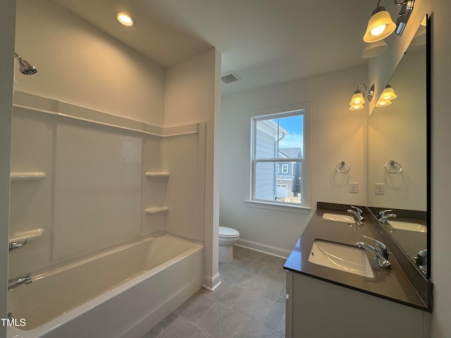 full bathroom featuring tile patterned flooring, shower / tub combination, vanity, and toilet