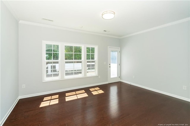 empty room with wood-type flooring and ornamental molding