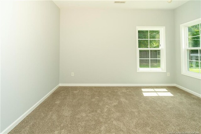 unfurnished room with carpet floors