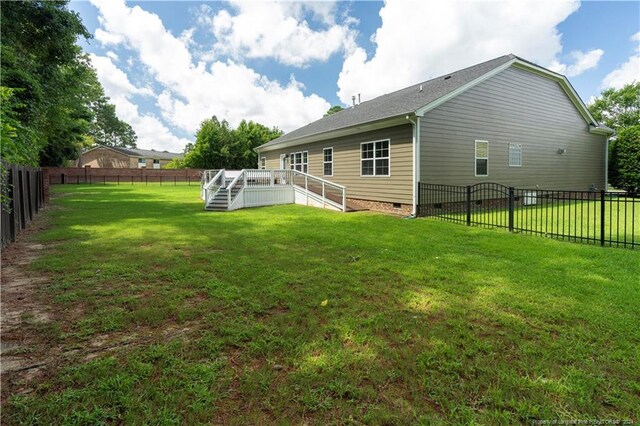 view of yard featuring a wooden deck