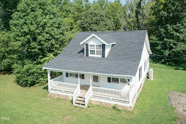 view of front facade featuring covered porch and a front lawn