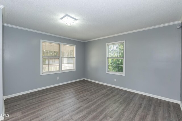 unfurnished room with a textured ceiling, hardwood / wood-style flooring, and ornamental molding