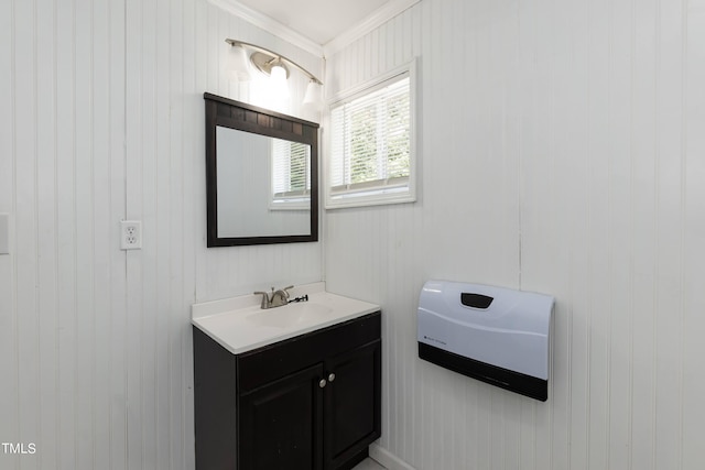 bathroom featuring vanity and ornamental molding