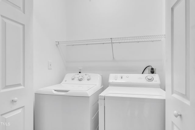 laundry room featuring washer and clothes dryer