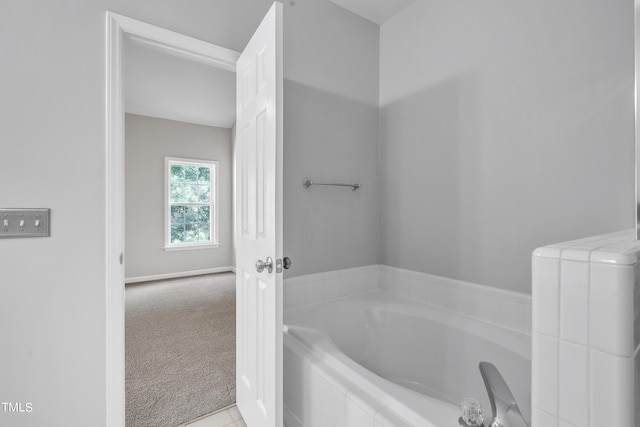 bathroom with tiled bath