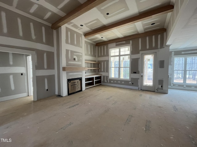 unfurnished living room featuring a healthy amount of sunlight