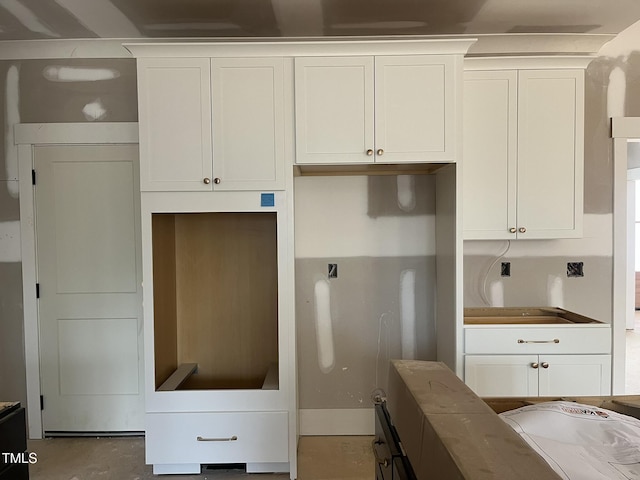 kitchen featuring white cabinets