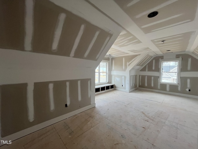 bonus room with plenty of natural light and lofted ceiling