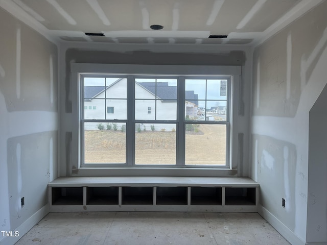 interior space featuring baseboards