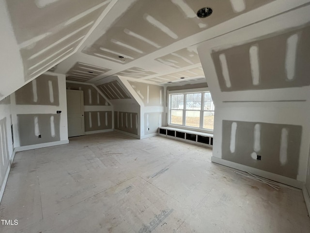 bonus room featuring lofted ceiling