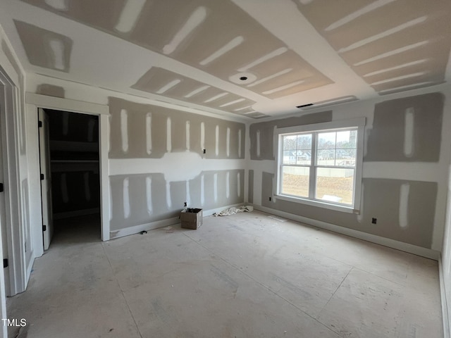 empty room featuring baseboards