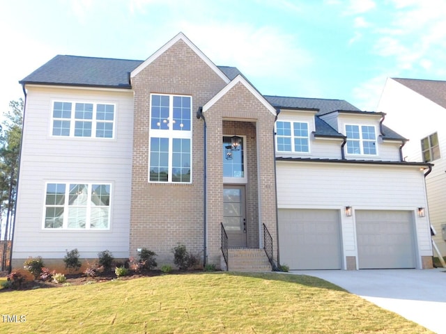 view of front of home featuring a garage and a front lawn