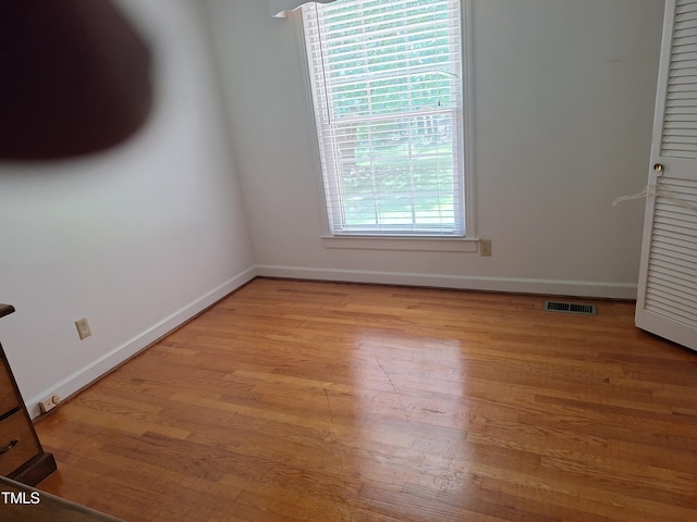 1917 New Hill Olive Chapel Rd, New Hill, NC 27562 - unfurnished bedroom with baseboards and light wood-type flooring