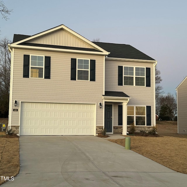 view of front of property featuring a garage