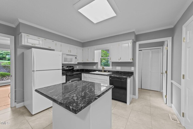 kitchen featuring light tile patterned flooring, sink, white appliances, and white cabinets