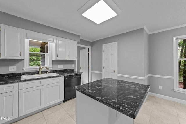 kitchen featuring dark stone countertops, crown molding, light tile patterned floors, white cabinets, and dishwasher