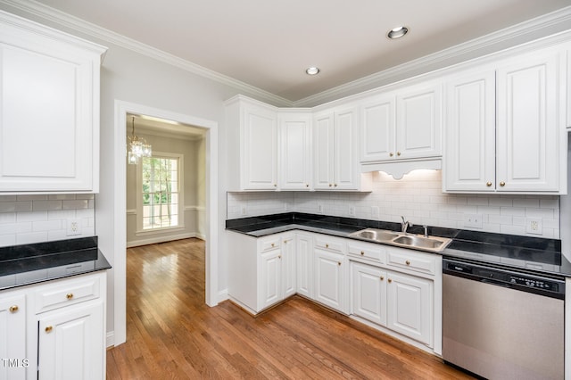 kitchen with sink, dishwasher, light hardwood / wood-style flooring, and backsplash