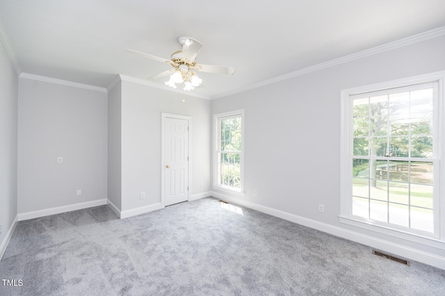 unfurnished bedroom featuring light carpet, ceiling fan, and ornamental molding