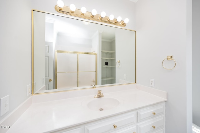 bathroom featuring vanity and ornamental molding