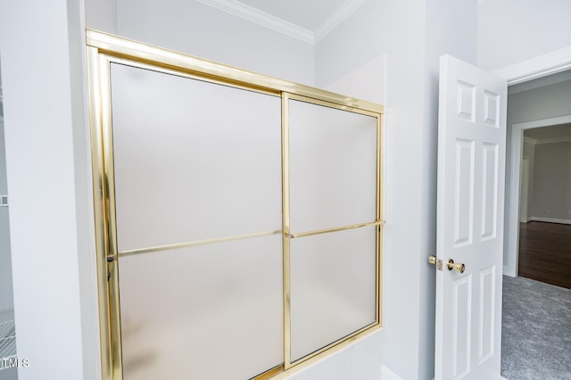 bathroom with wood-type flooring and crown molding