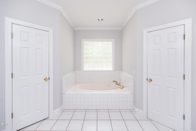 bathroom with tile patterned flooring, tiled bath, and crown molding