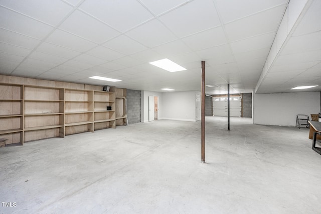 basement featuring a drop ceiling