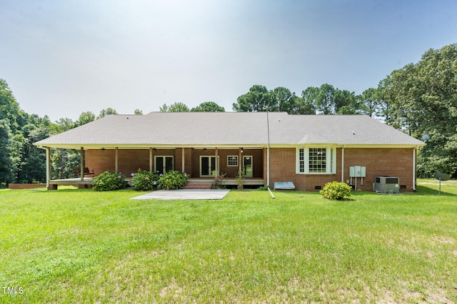 back of house with a patio, central AC, and a yard