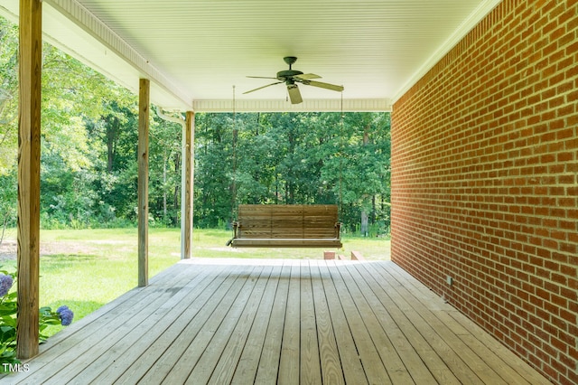 wooden terrace featuring ceiling fan