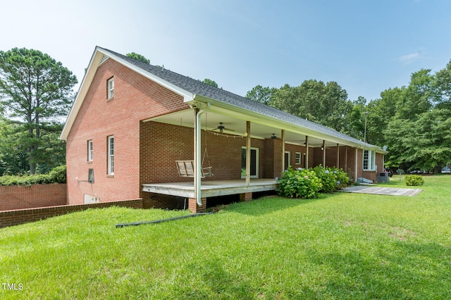 back of house featuring a yard