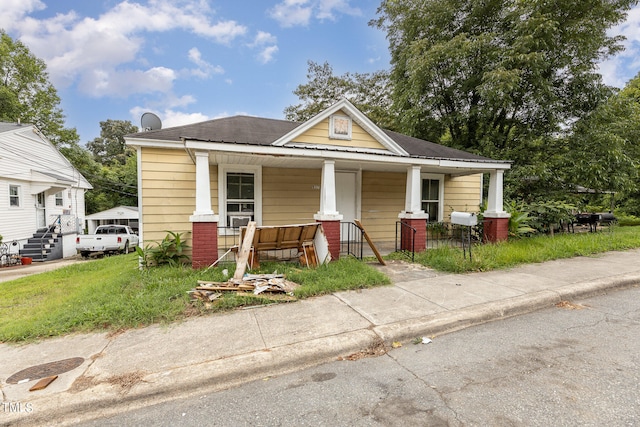 bungalow-style home featuring a porch