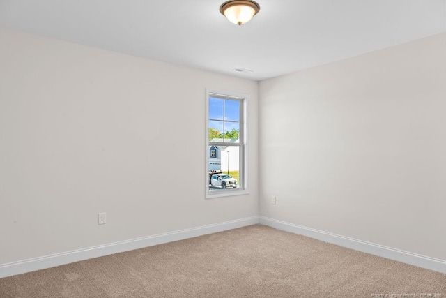 unfurnished room featuring carpet flooring