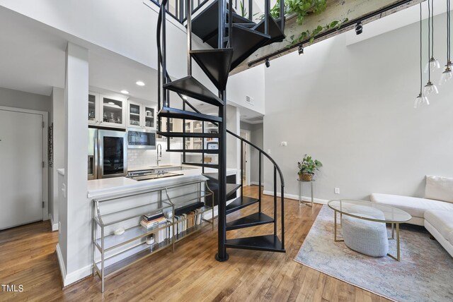 stairway featuring hardwood / wood-style flooring