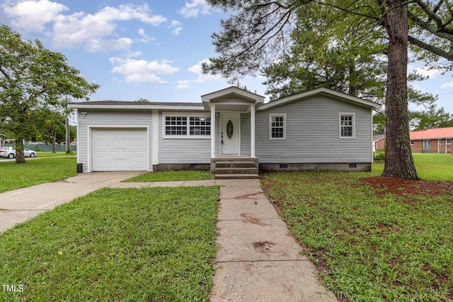 view of front of property with a garage and a front yard