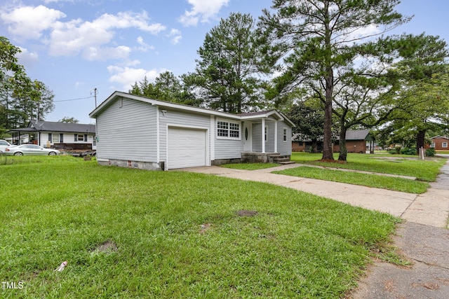 view of front of house with a garage and a front yard