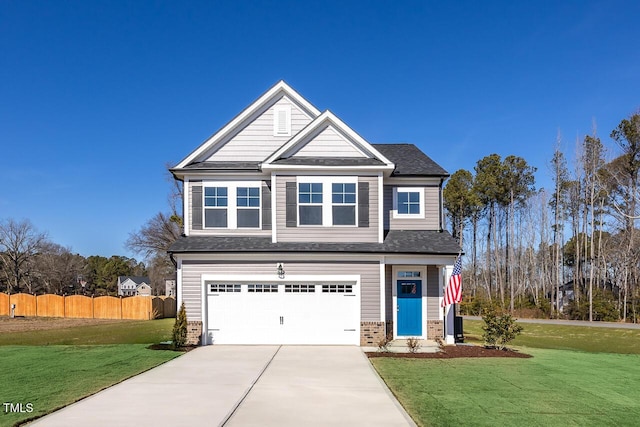 craftsman house with a garage and a front lawn