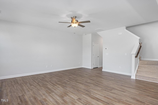 unfurnished living room featuring wood-type flooring and ceiling fan