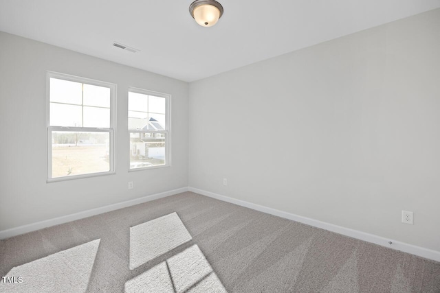 carpeted empty room featuring a healthy amount of sunlight