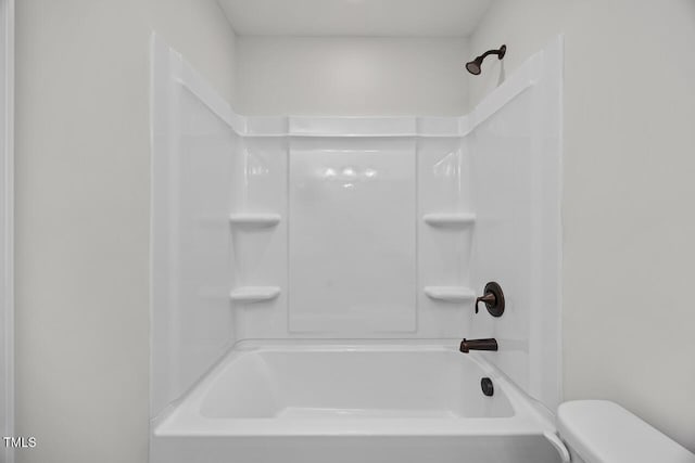 bathroom with toilet and shower / washtub combination