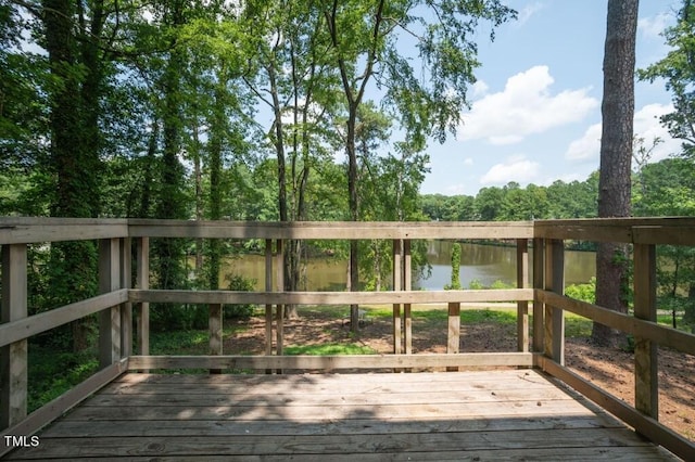 wooden deck with a water view