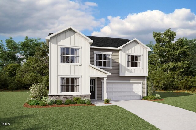 view of front of house with a front yard and a garage