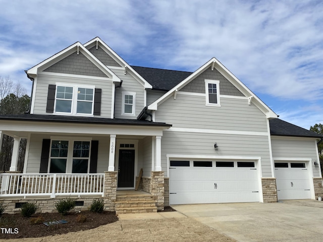 craftsman house with a garage and a porch