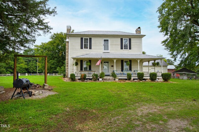 view of front facade with a front lawn and a porch